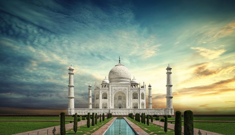 The Taj Mahal mausoleum at sunset
