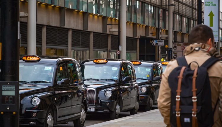 Black taxi cabs outside King's Cross Station, London