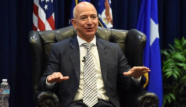 Jeff Bezos sitting in an armchair