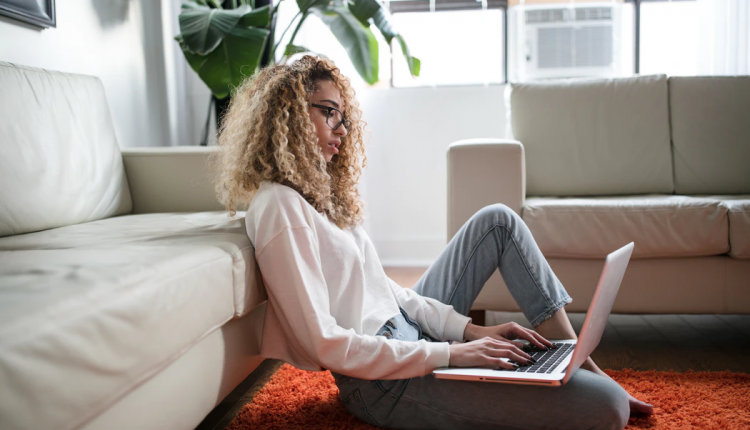 Young woman working from home on a laptop