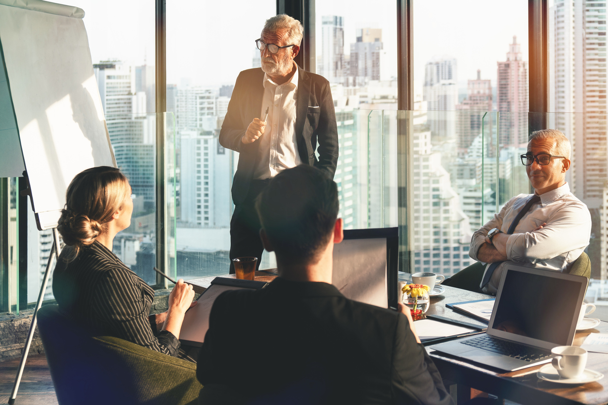 Executive team meeting in skyscraper office