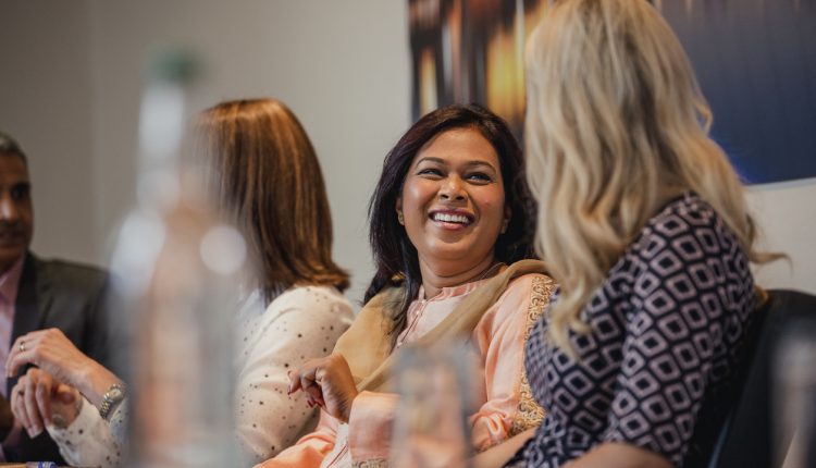 Female business executives talking before a meeting