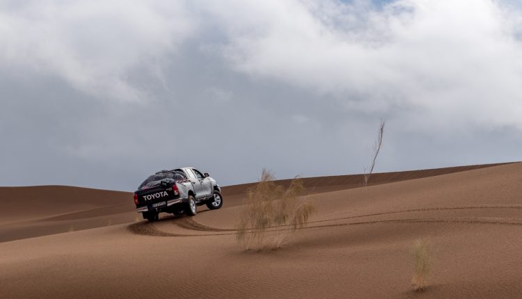 Toyota Hulux Revo driving off-road in the Lut Desert
