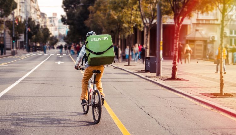 Bike courier making an inner-city delivery