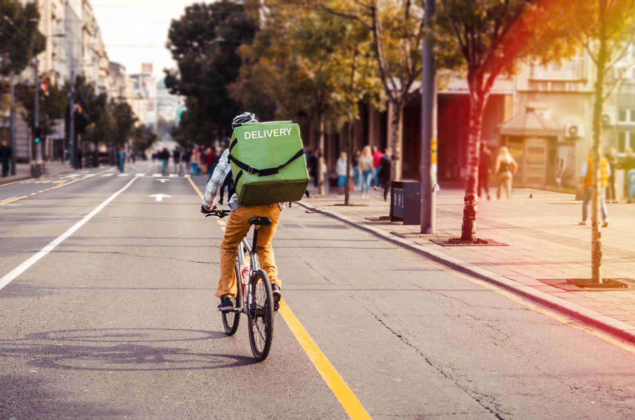 Bike courier making an inner-city delivery