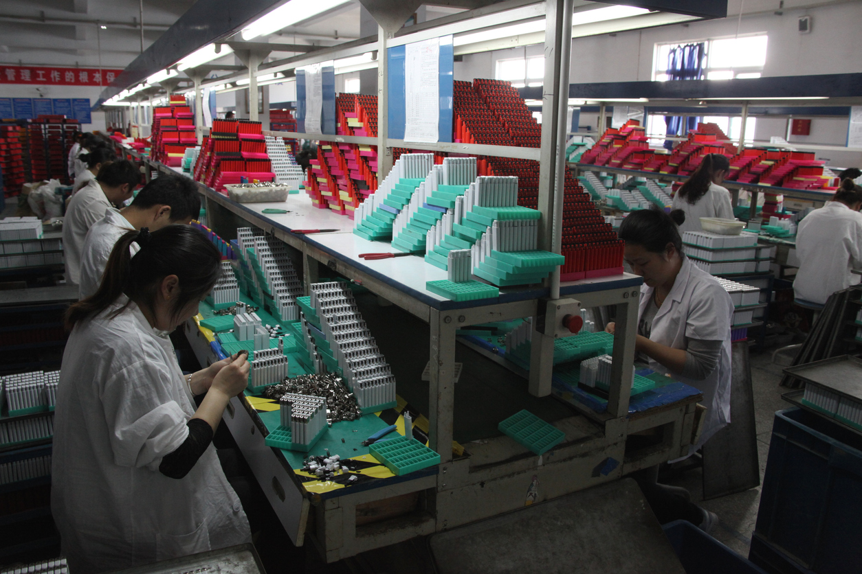 Chinese factory workers assembling lighters