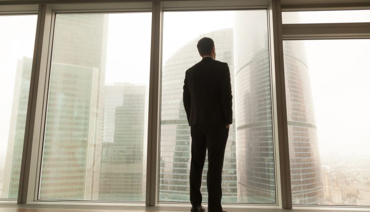 CEO standing at a window