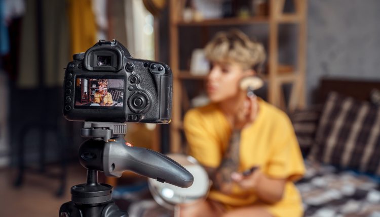 Influencer applying makeup on camera