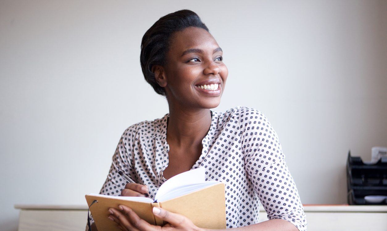 Young female business leader reading a book