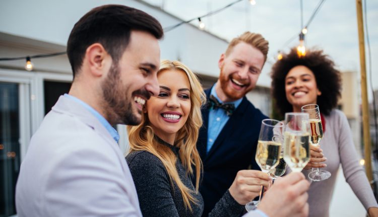 Affluent young people toasting with champagne