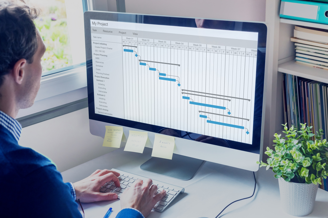 Project manager working on a Gnatt chart schedule