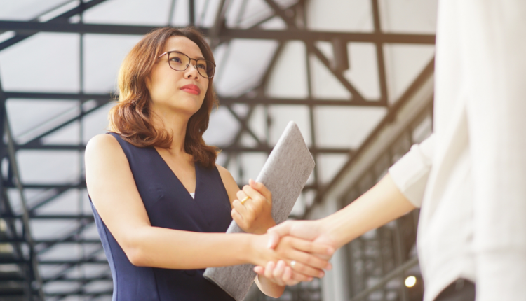 Businesswoman meeting with partner