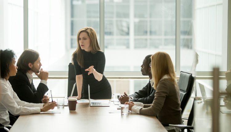 Female CEO leading board meeting