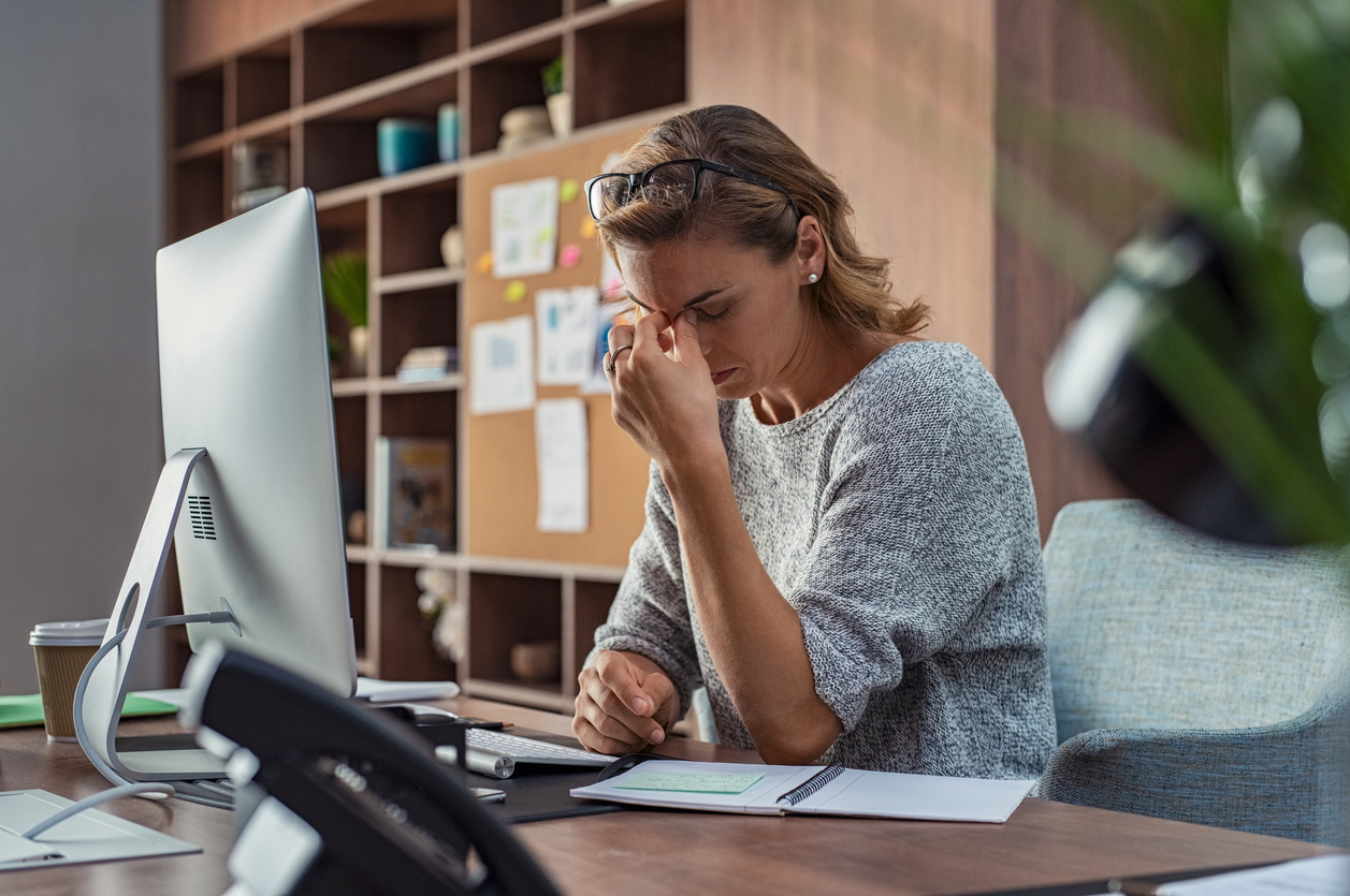 Woman stressed in workplace