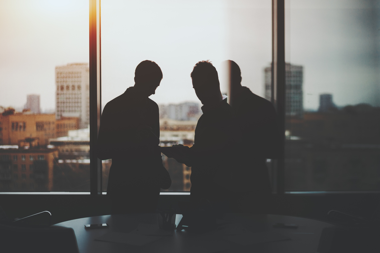 Silhouette of CFO and CEO