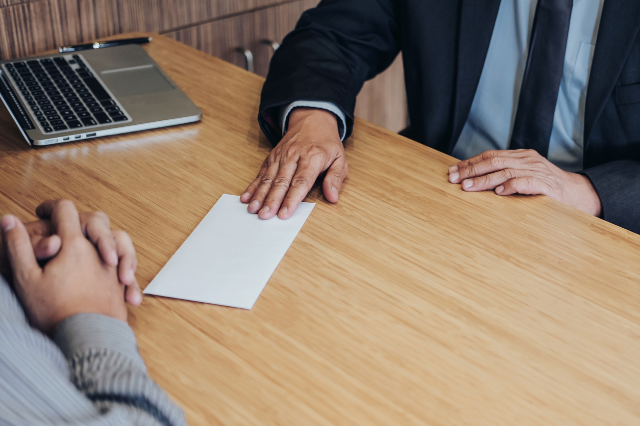 Employee handing in resignation