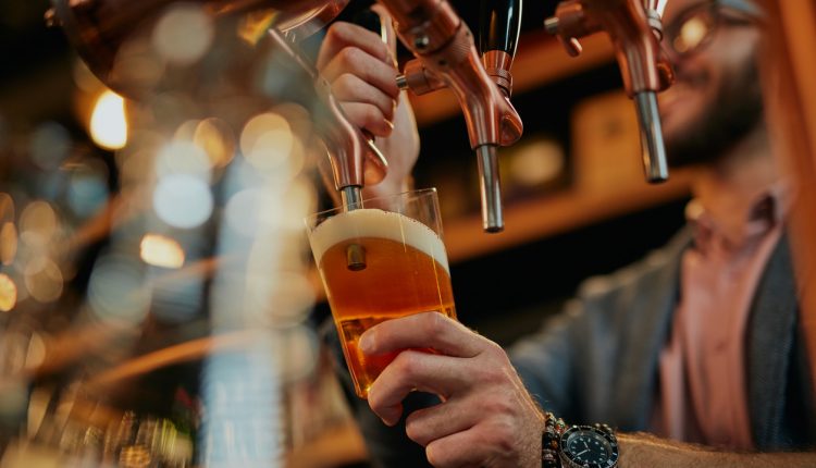 Barman serving customer