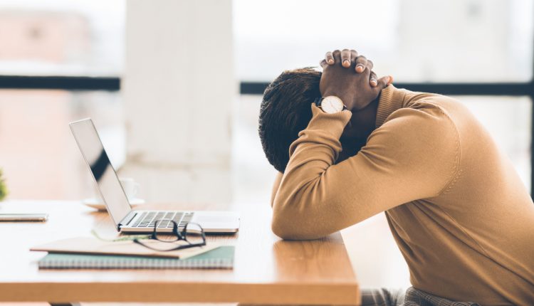 Employee burnout at work desk