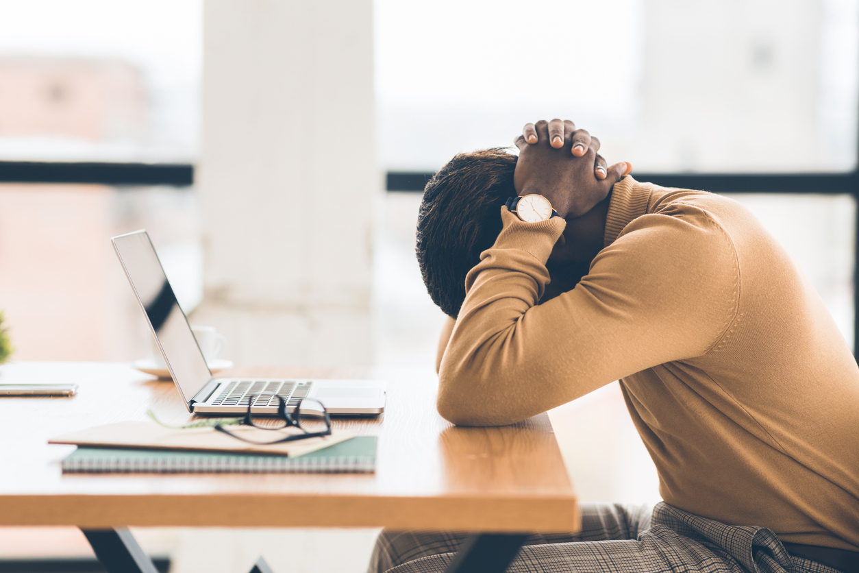 Employee burnout at work desk