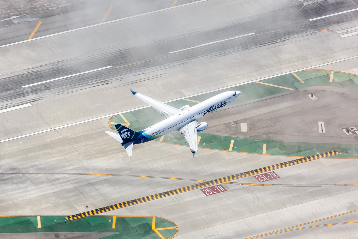 Alaska Airlines Boeing 737-900ER airplane Los Angeles International Airport in California aerial view