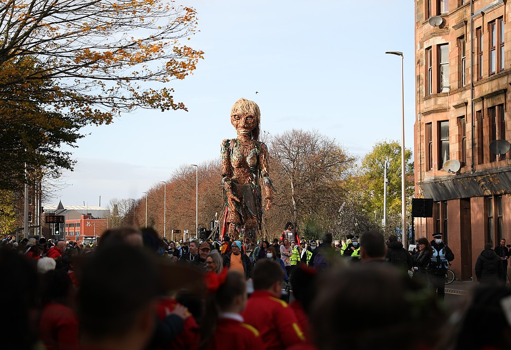 Puppet of a sea goddess walking through Glasgow during the COP26 climate change summit.