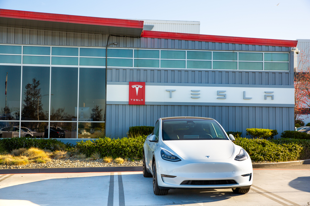 Tesla car parked outside Tesla factory plant