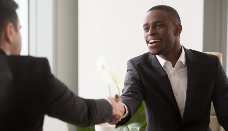 Man shaking hands with potential employer