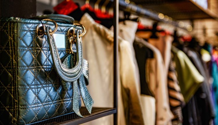 Handbags and clothes in a second-hand fashion store