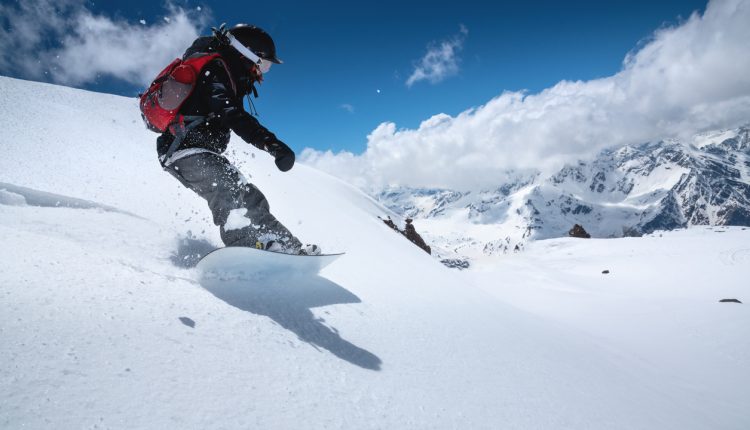 Woman snowboarding