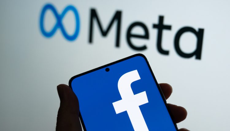 Meta logo with Facebook logo on phonescreen