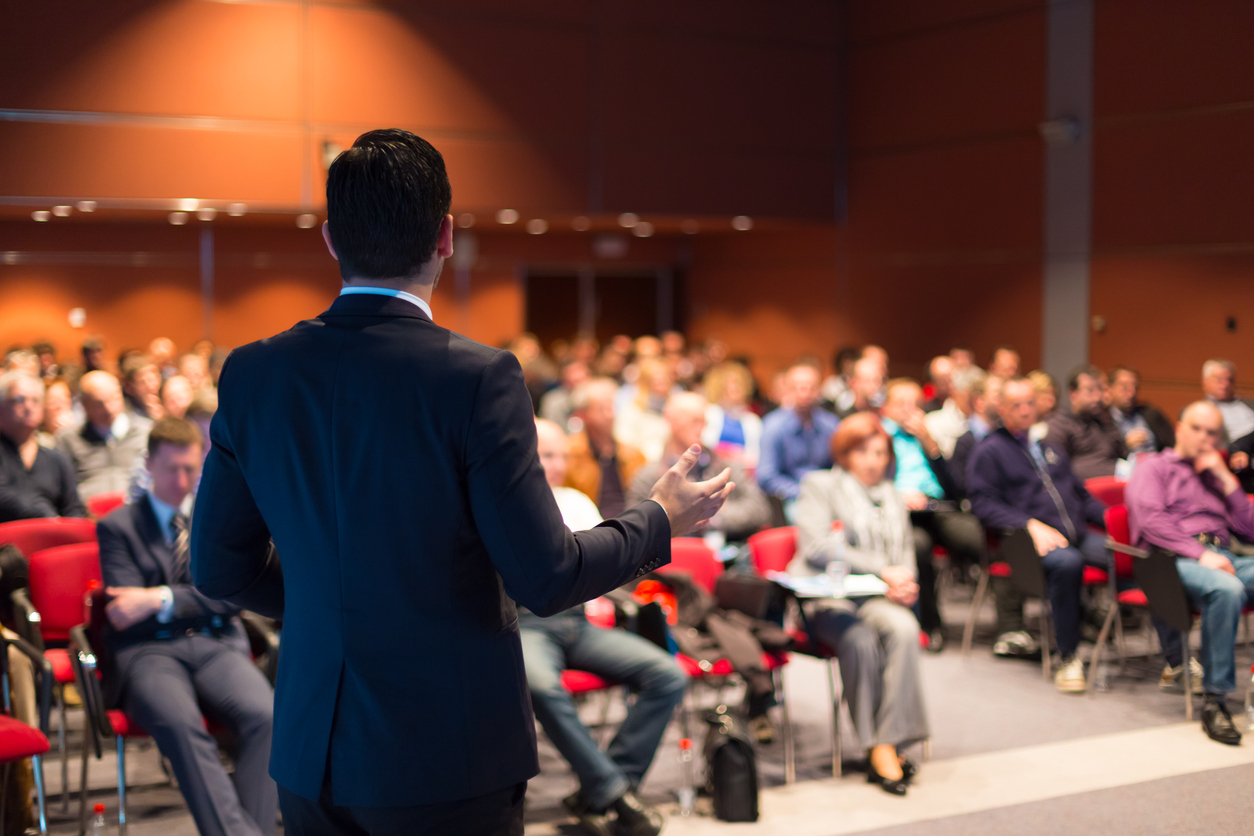 A man speaking at a business event