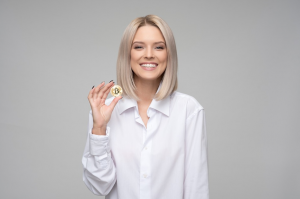 Woman holding bitcoin