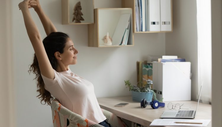 Happy young woman satisfied with finishing work relax stretch muscles