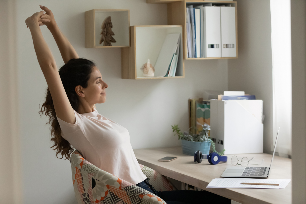 Happy young woman satisfied with finishing work relax stretch muscles