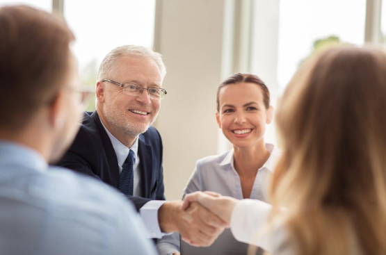 CEO shaking hands with employee