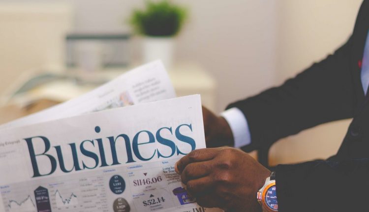 Businessman reading business magazine