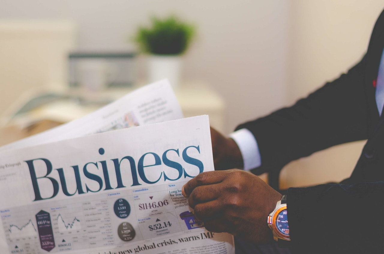 Businessman reading business magazine