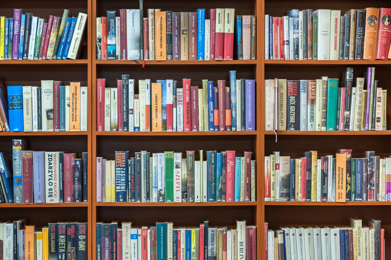 Bookshelf in public library, front view, horizontal