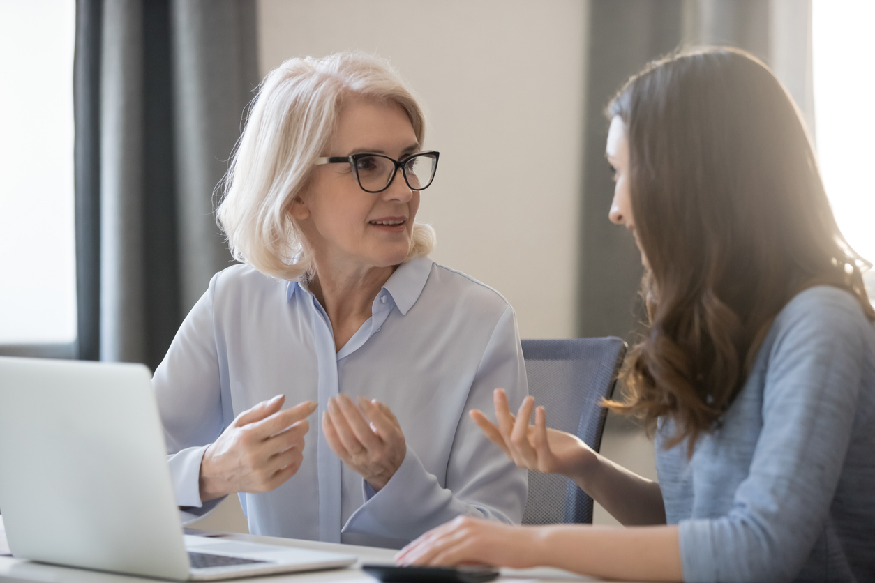 Business leader mentoring younger employee