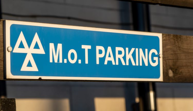Close up of an MOT parking sign at a garage