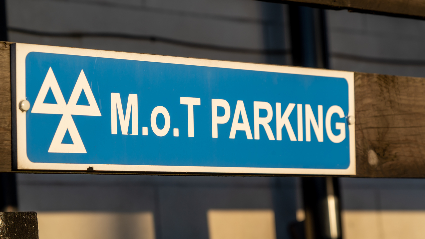 Close up of an MOT parking sign at a garage