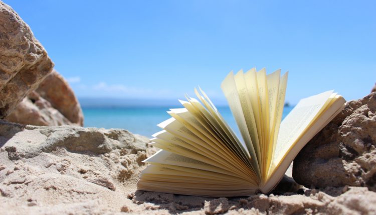 Open book on beach