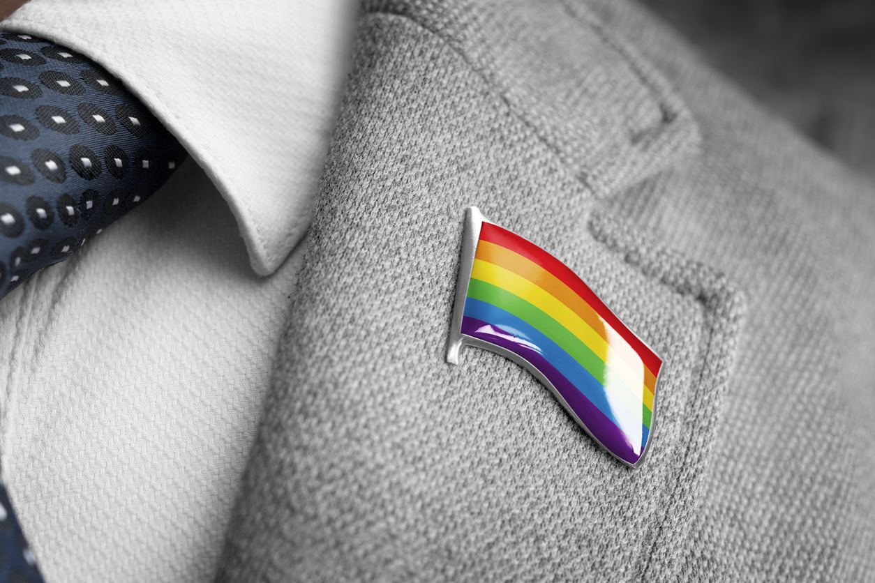 Metal badge with the flag of lgbt on a suit lapel
