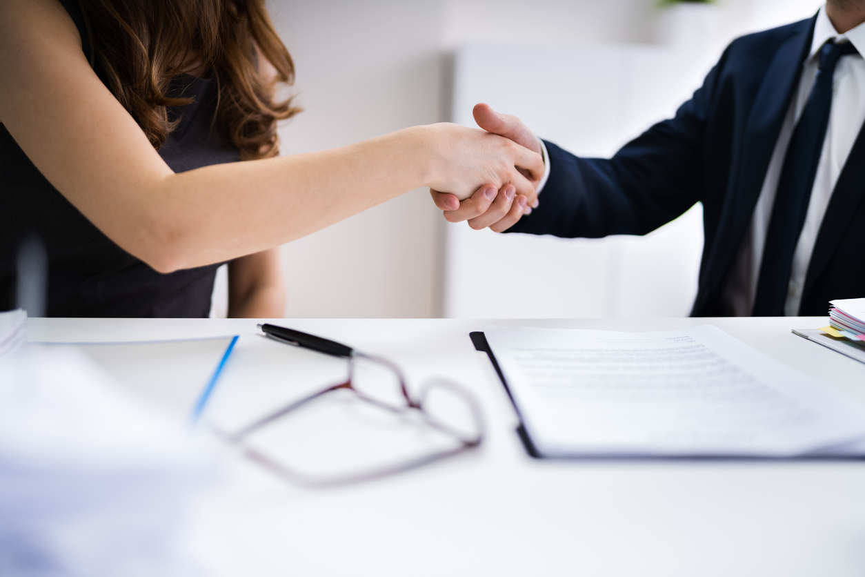 Handshake after successful mediation at work