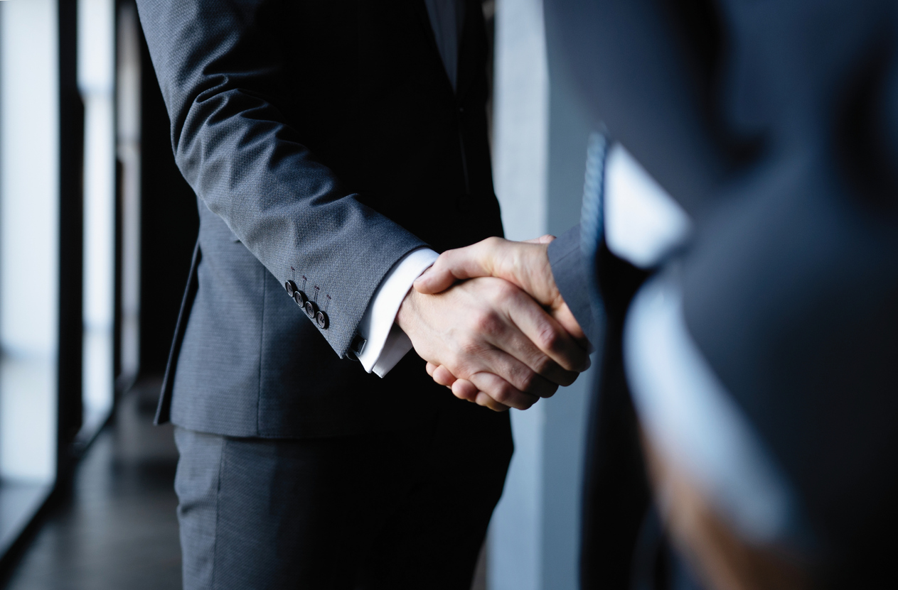 Business people shaking hands, finishing up a meeting