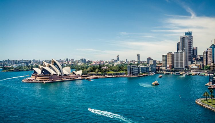 Sydney Opera House and Circular quay, ferry terminus, from the harbour bridge.