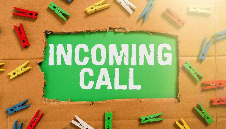 Hand writing sign Incoming Call, Concept meaning Inbound Received Caller ID Telephone Voicemail Vidcall Important Ideas Written Under Ripped Cardboard With Colored Pegs Around.