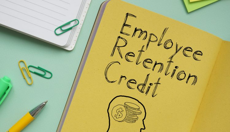 Employee Retention Credit ERC is shown on a business photo using the text