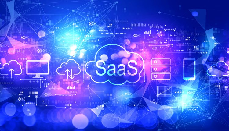 SaaS - software as a service concept with technology blurred abstract light background