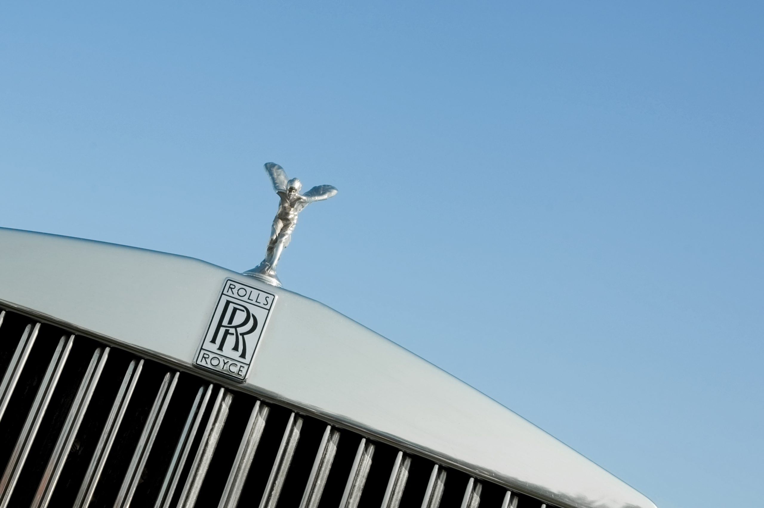 "Rushmoor, UK - April 22, 2011: The Rolls Royce Spirit of Ecstasy vehicle hood mascot, sometimes known as The Silver Lady was designed by Charles Robinson Sykes; and is one of the worlds most recognisable corporate images."